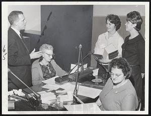 With Legislature driving to prorogation, Secretary of State Kevin White, extreme left, and some of his staff work around the clock engrossing bills. Pictured at work this morning after all night stint are, from left, White, Florence M. Sherman of Cambridge; Ann McDonough of Dorchester; Anne Denehy of Brighton, and Theresa Mustone of North End.
