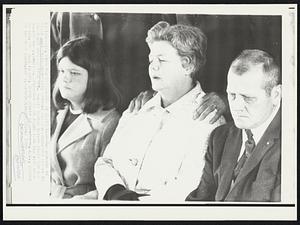 Parents at Graveside--The parents of slain Kent State University student William Schroeder listen to the final message from Rev. Donald Yaekle before their son was buried today. Louis A. Schroeder is at right with his wife next to him. At left is Mrs. Berry Schotz of Lawrence, Kan., sister of the dead youth.