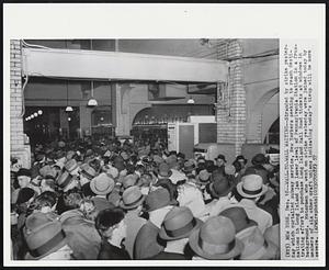 Wall-to-Wall Waiting -- Stranded by strike yesterday which curtailed subway service, New Yorkers seeking to reach destinations in Long Island jam lower level of Pennsylvania Station in a frustrating effort to purchase Long Island Rail Road tickets at windows in background. Motormen who went on strike yesterday were joined today by members of six other craft unions indicating today's tieup will be more severe.