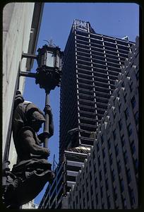 A sculpture attached to 100 Franklin Street, Boston