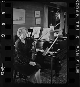 Florence Chapman Pearson seated with violin near piano