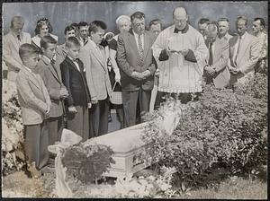 Tiny murder victim laid to rest