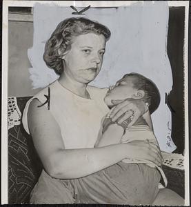 Mother of slain child waits for news