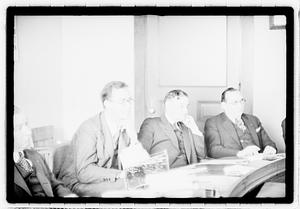 Group of men at table