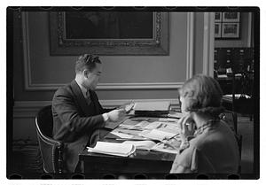 A man seated at a desk
