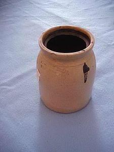 Stoneware jar with a dark mark