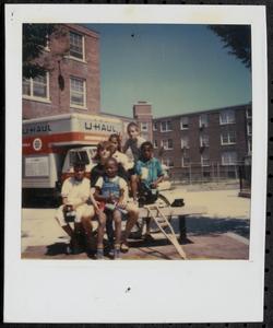 Group posing on a bench in Newtowne Court
