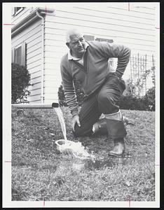 Harry Tiday of 20 Wilson Road, Stoneham stands by his cellar pump outlet.