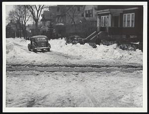 Rutted sidestreets--Deep furrows in packed snow still unplowed on Quincy street, Roxbury, shortens motorists tempers.