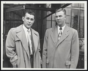 They're Not Too Pleased with Boston Weather, but these Phillies still intend to take a stroll before reporting to Braves Field for their game with the Braves this afternoon. Shown leaving the Hotel Kenmore are First Baseman Nippy Jones, left, and Pitcher Andy Hansen.