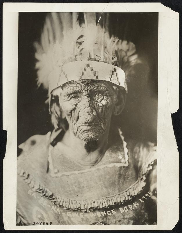 134 Years Old and Still Handsome:: The World's Oldest Man. Meet Ka-Be-Nah-Gway-Wence (Wrinkled Meat)--known to tourists as plain John Smith, of Cass Lake, Minn. Ka-Be-etc., recently celebrated his 134th birthday party and some think he may be even older than that--as the skin on his face is almost ossified. The aged buck is veteran of nine marriages and six battles with the Sioux. He has the war bonnets of five Sioux Chiefs whom, he says, he killed, Ka-Be came out of the Canadian northwest and settled in Cass Lake 10 years ago.