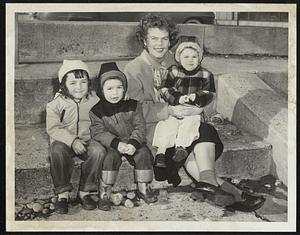 Enjoying spring weather at Revere Beach. L to R. June Robertson 5. Robert Carbone 3. Mrs Hazel Carbone + John Carbone 2. Weather Warm