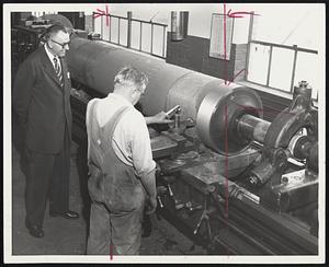 Let 'Er Roll-E. W. Peterson, president of Stowe-Woodward of Newton, watches Werner Joncher perform the lathe work in preparation of a roll core at Stowe-Woodward's new plant in Neenah, Wis.