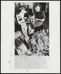 "Postoffice" by Long Distance. Betty Adams (above), 18, thinks she has an answer to her fiance's complaints that her letters are too short: An epistle 36 feet long and weighing five pounds. She finishes it today and it's going off to Donald W. Jackson, 21, of Denver, a fireman aboard the U.S.S. Wisconsin at Portsmouth, Va. Betty typed the letter on shelf-lining paper and pasted on it photos, clippings, razor blades, sticks of gum and other knick-nacks.