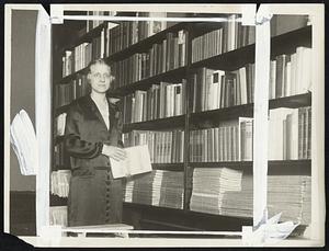 Federation of Women's Clubs Founds First All-American Library A unique library consisting of books by and about native Americans is now being assembled at headquarters of the General Federation of Women's Clubs in Washington. The library when completed will present a comprehensive cross-section of American non-fiction literature as each state in the union has been requested to furnish at least 12 books by and about persons of the state. Virtually all of the noted American authors are represented, some of them with autographed copies. Photograph shows Miss Josephine Junkin, Director of Headquarters, examining some of the volumes already received.