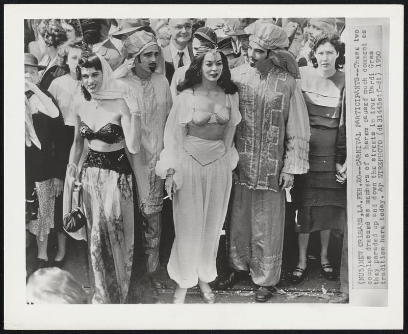 Carnival Participants--These two couples dressed as members of a harem caused much comment as they paraded up and down the streets in true Mardi Gras tradition here today.