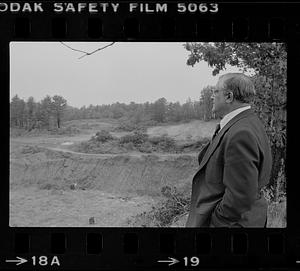 Peter Matthews looking at vacant lot