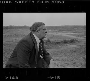 Peter Matthews looking at vacant lot