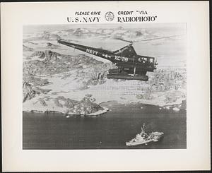 Helicopter from USS Edisto hovering over Station 13 off un-named area of Knox coast of Antarctica