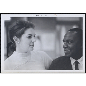 Clarence "Jeep" Jones conversing with a female staff member