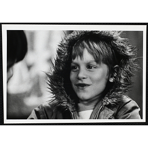 A boy from the Boys' Clubs of Boston wearing a fur-lined hood