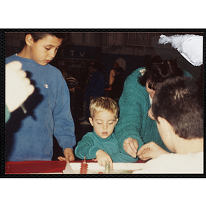 A boy plays a game at a Halloween event