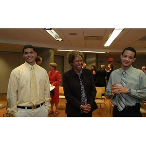 Danny Vazquez and Odalis David Polanco with a woman at the Torch Scholars dinner