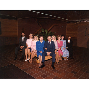 Snell family sits together on a bench at the Snell Engineering Building dedication