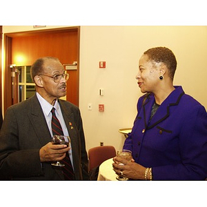 Teri Williams, right, speaking with another guest at the College of Business Administration's Distinguished Service Awards ceremony