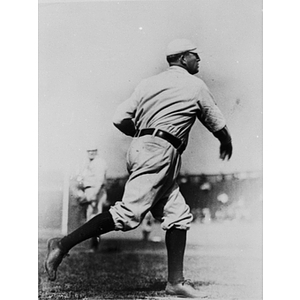 Boston Americans pitcher, Cy Young, pitching at the first World Series in 1903 at the old Huntington Avenue Baseball Grounds