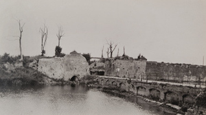 View of road and damaged town gate into Ypres