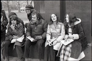 Richard Safft (center) and other commune members sitting by during interview by Channel 5 news