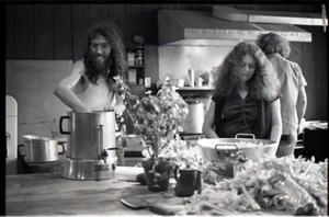 Tom Howes and unidentified woman in commune kitchen