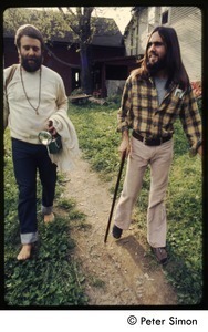 Two men walking past the house, Tree Frog Farm commune