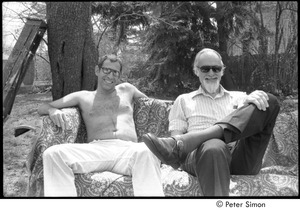 Ram Dass retreat at David McClelland's: David McClelland (right) sitting on a couch outdoors next to an unidentified man