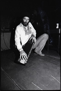 Beach Boys at Boston College: Mike Love kneeling with keyboard