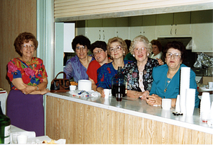 Women posing in kitchen of Saint Anthony's Rectory