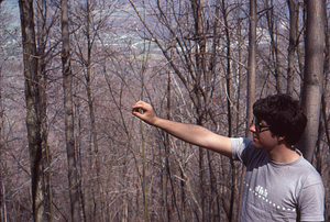 David Stevens, Williams Class of 1983, with basal area prism measuring young forest.