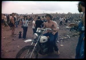 Shirtless man on a dirt bike at the Woodstock Festival