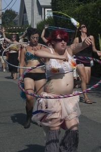 Parade marchers wielding hula hoops : Provincetown Carnival parade