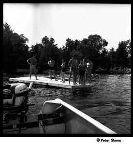 Camp Arcadia: campers on a floating dock in the lake