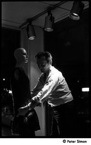 Jean Levy dressing a mannequin in a window display at Cyreld's boutique, Coolidge Corner