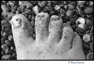 Foot on a pebbled beach