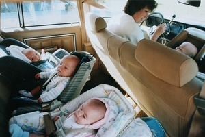 Ann Anderson driving in the car with her quadruplets