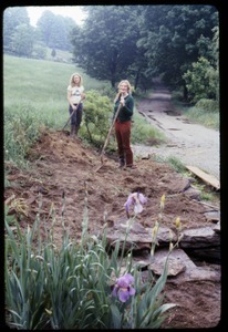 Janice Frey (left) and Sue Kramer digging beds in front of the house, Montague Farm Commune