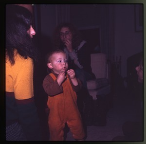 Nina Keller, Charles Light, and baby (Eben Light) in the living room, Montague Farm Commune