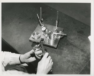 Hands inspecting materials created by ICD's industrial services division