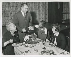 Mr. Burrows and clients eating turkey