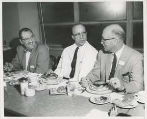 Attendees sitting down to a meal at a joint meeting of the American society of tool engineers and ICD