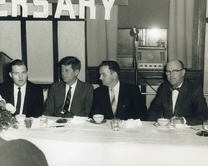 Charles Santos Jr. with John F. Kennedy at banquet table